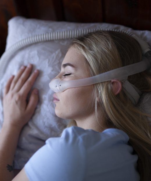 Woman sleeping soundly thanks to C P A P therapy in Frisco
