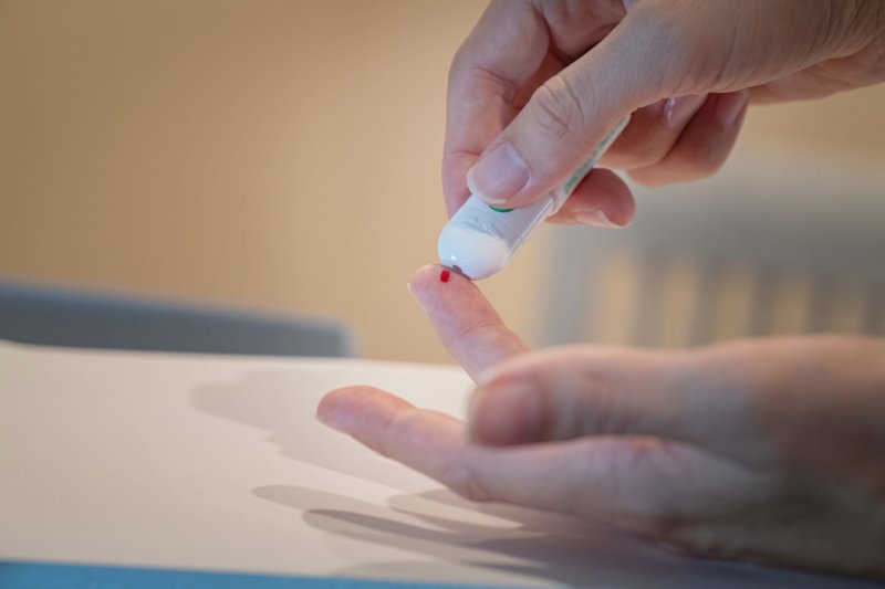 a person checking their blood sugar level